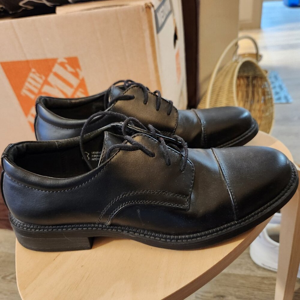 Black derby dress shoes